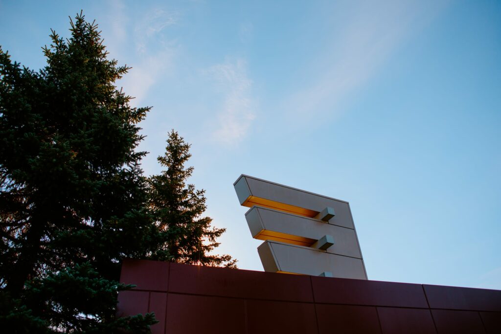 A picture of the exterior of Cambrian College and a tree in the foreground