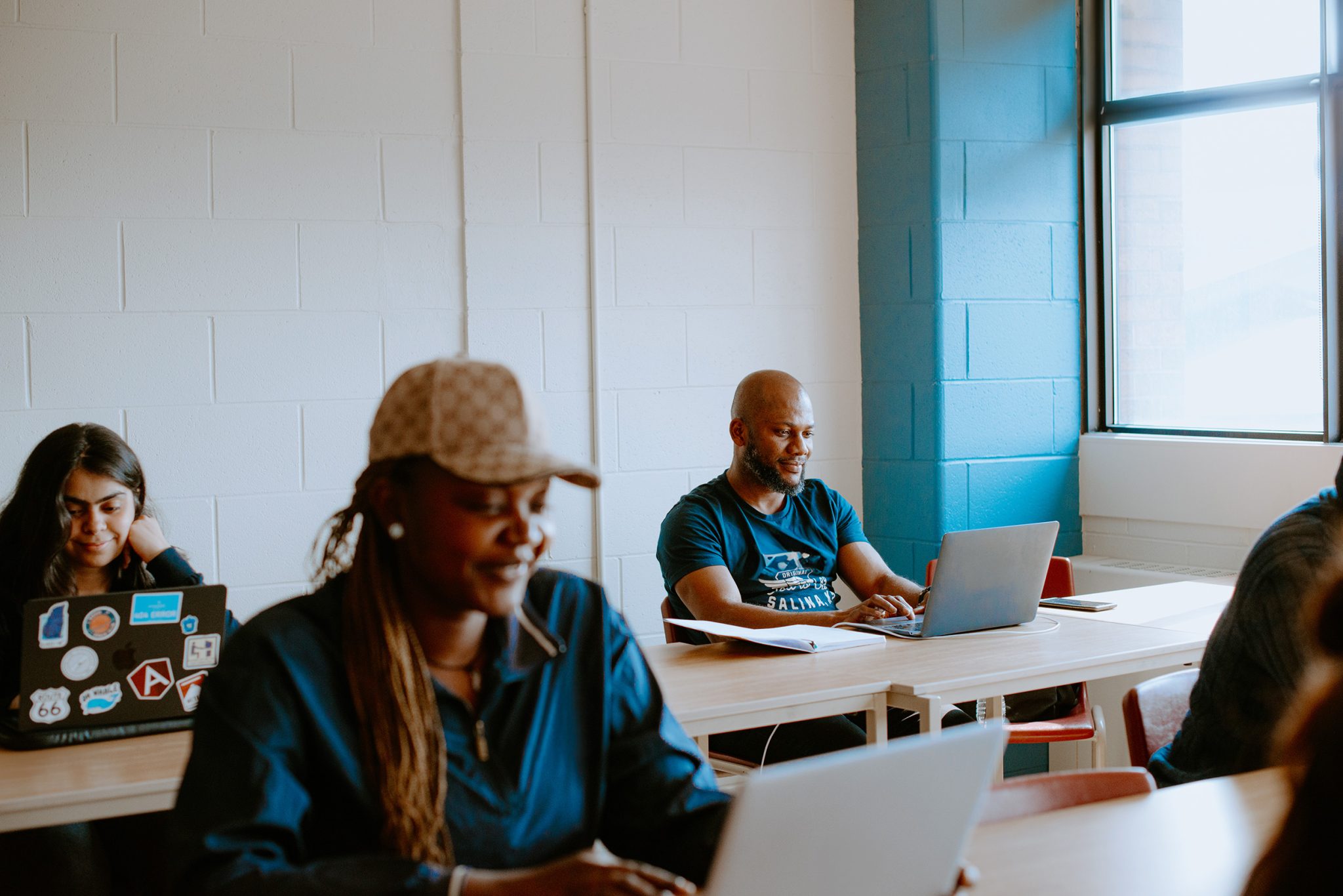 Students on laptops in a classroom