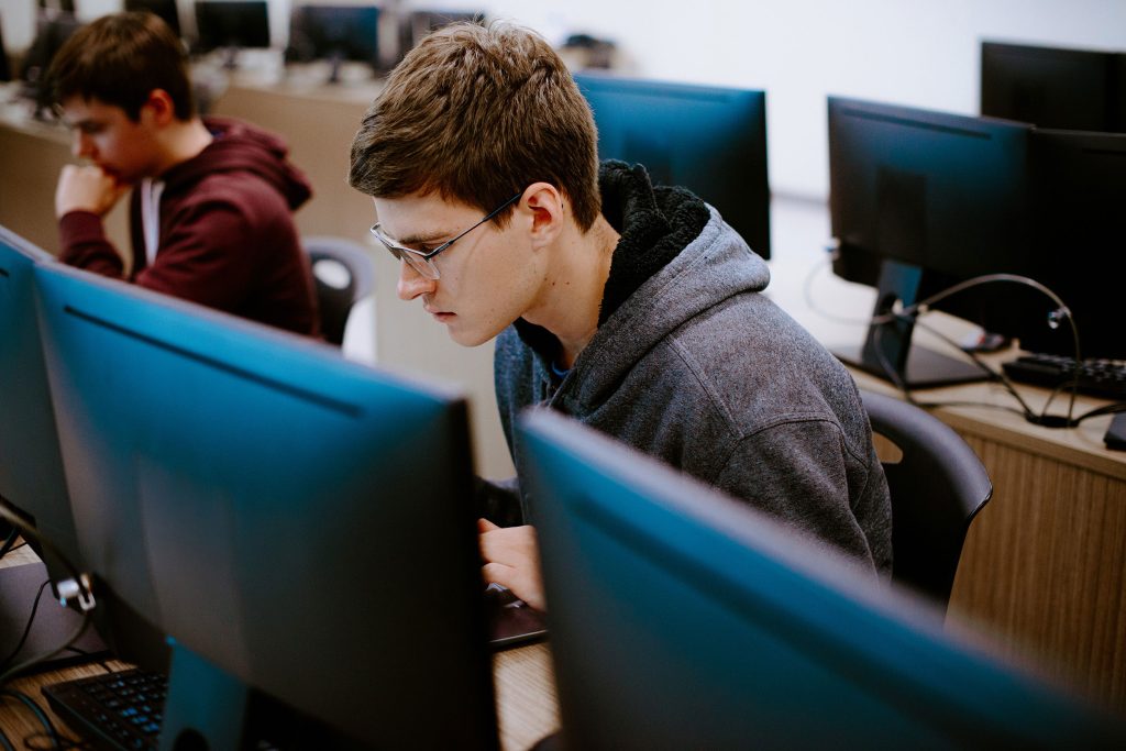 Student on computer in a lab classroom setting