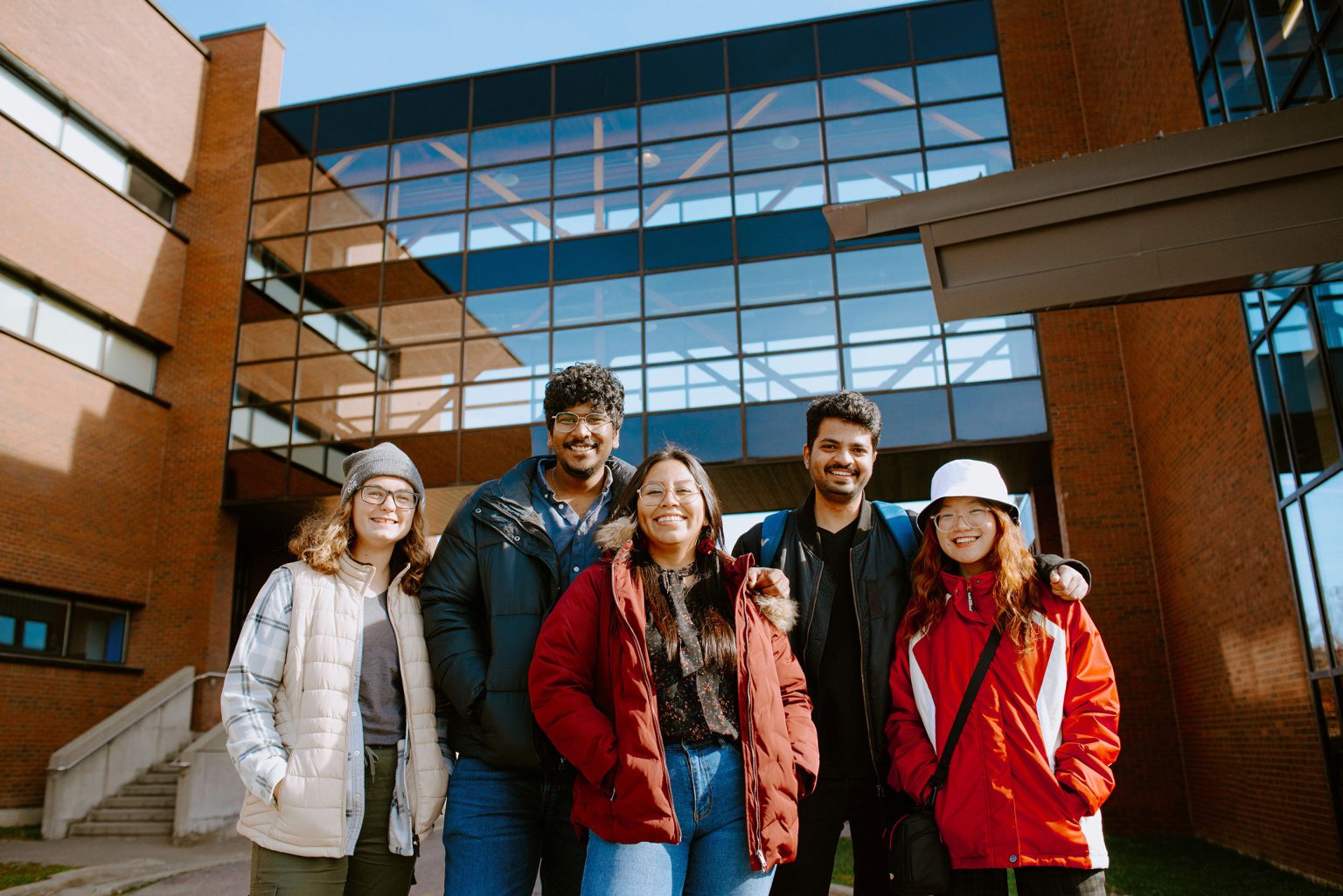 5 students standing outside of Cambrian college campus