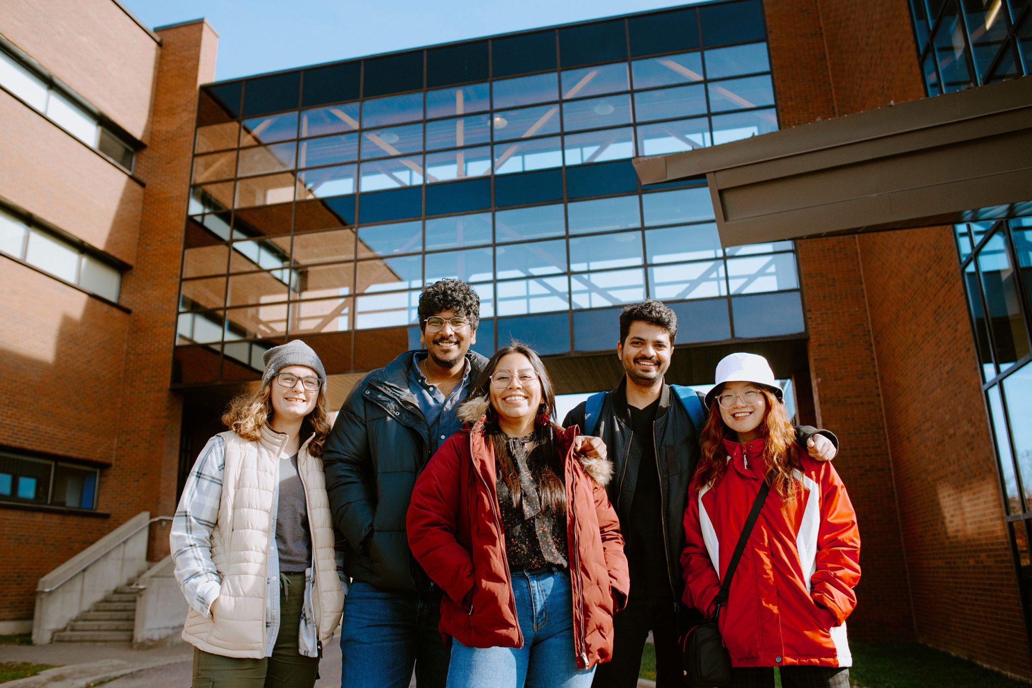 5 students standing outside of Cambrian college campus